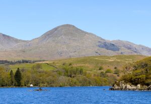 The Old Man of Coniston mountain towering behind the lake.
