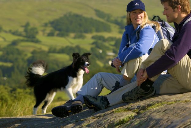 A couple having fun with their dog