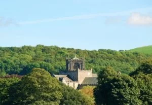 Cartmel Priory in amongst the trees