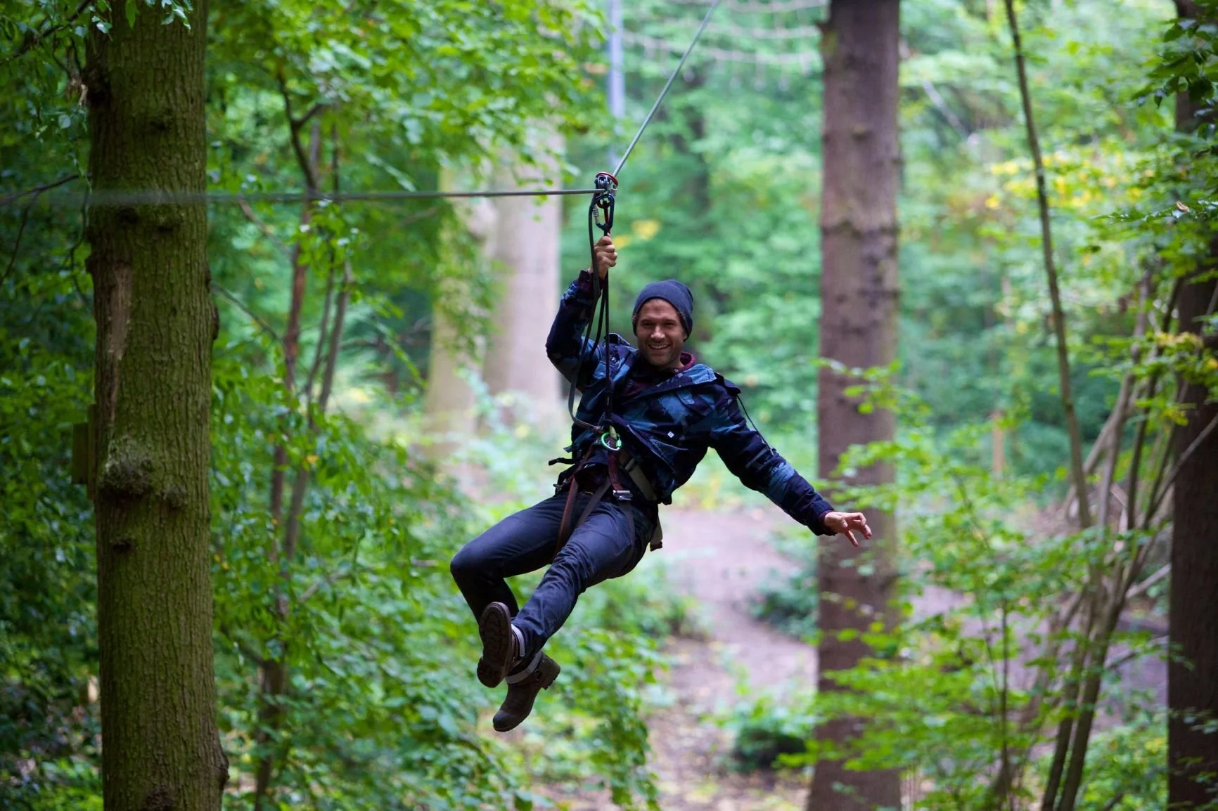 Image of a man on a zip wire in Grizedale Forest
