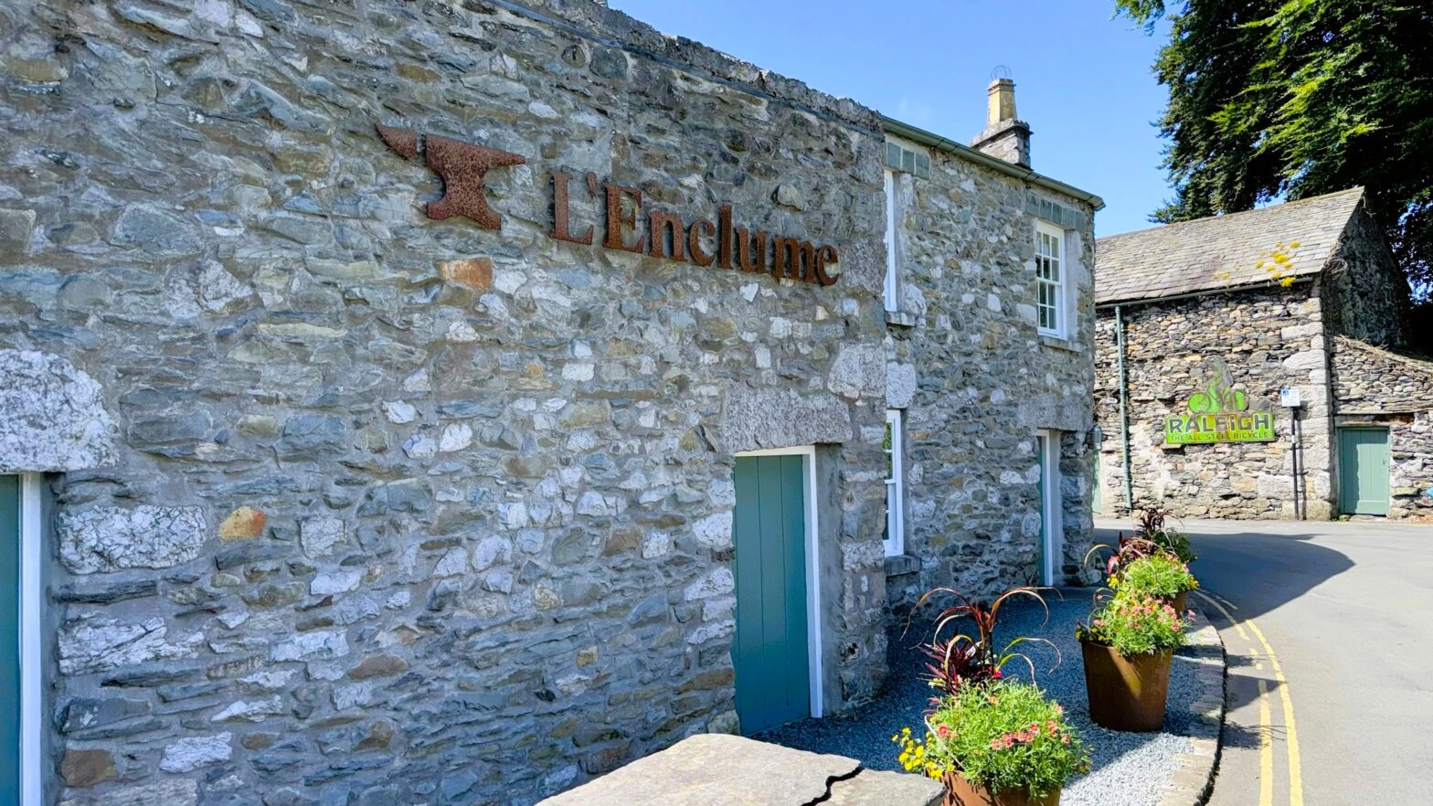 Exterior view of L'Enclume three-Michelin-starred restaurant in Cartmel, Cumbria