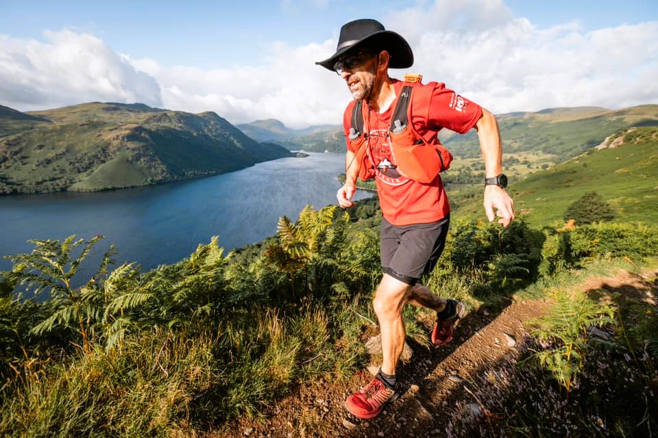 Man running in the Lakeland 100 race in the Lake District