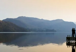 A couple enjoying a romantic Lake District view