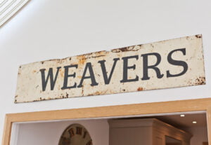 The origial old metal 'weavers' sign in the conservatory