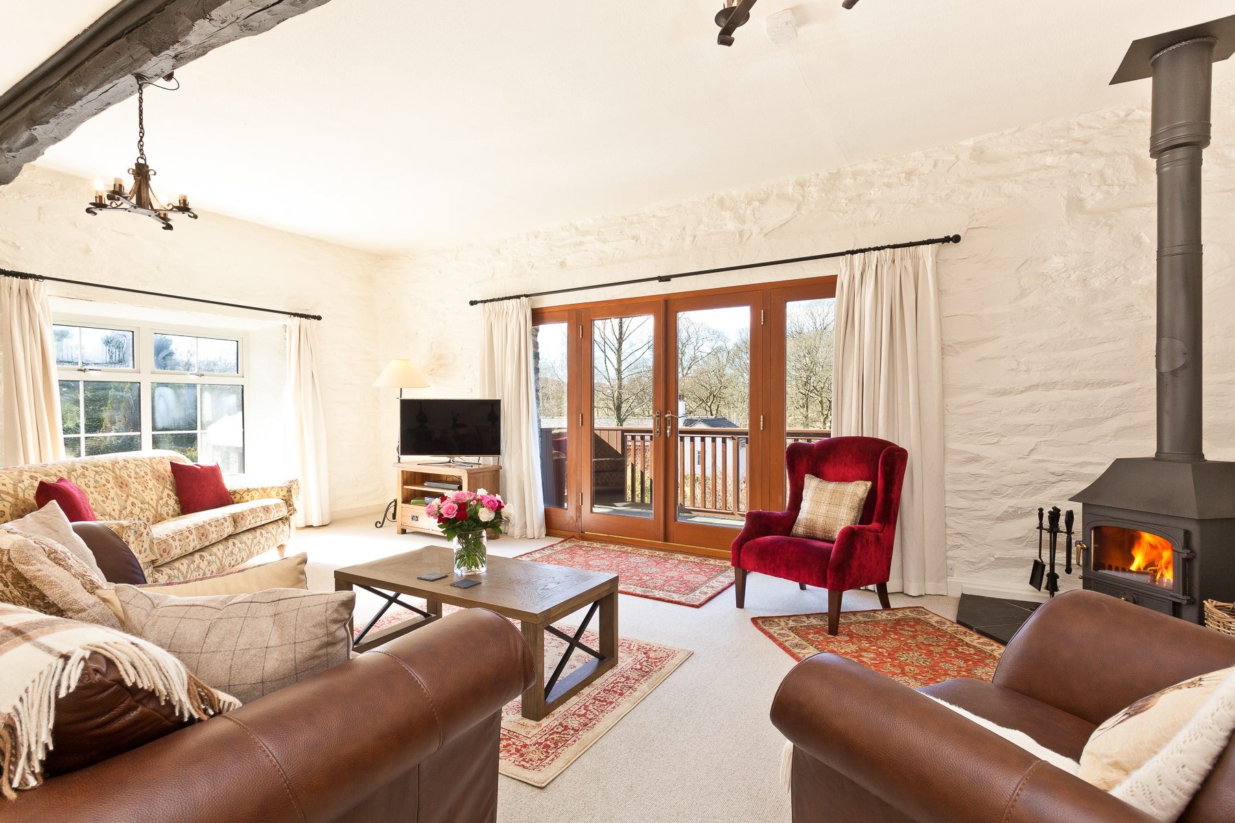 The sitting room and sunny balcony at Charcoal House