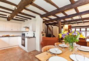 The kitchen, dining and sitting areas in Carree Cottage